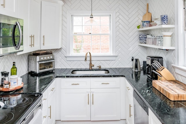 213 Kensington Ave, Lynchburg, VA 24503 - kitchen featuring stainless steel appliances, a sink, open shelves, decorative backsplash, and white cabinets