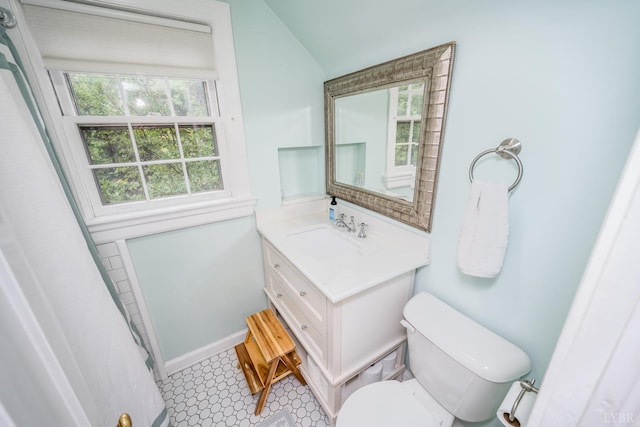 213 Kensington Ave, Lynchburg, VA 24503 - full bathroom with plenty of natural light, vanity, toilet, lofted ceiling, and a shower with curtain