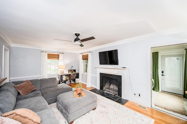 213 Kensington Ave, Lynchburg, VA 24503 - living room featuring ornamental molding, wood finished floors, a fireplace with flush hearth, and ceiling fan