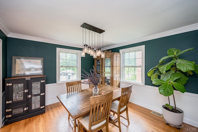 213 Kensington Ave, Lynchburg, VA 24503 - dining room with plenty of natural light, crown molding, wood finished floors, and baseboards