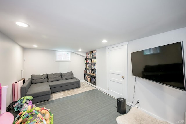213 Kensington Ave, Lynchburg, VA 24503 - living area with wood finished floors, radiator heating unit, and recessed lighting