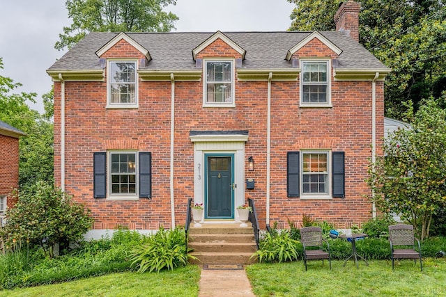 213 Kensington Ave, Lynchburg, VA 24503 - view of front of property with a chimney, a shingled roof, brick siding, and a front yard