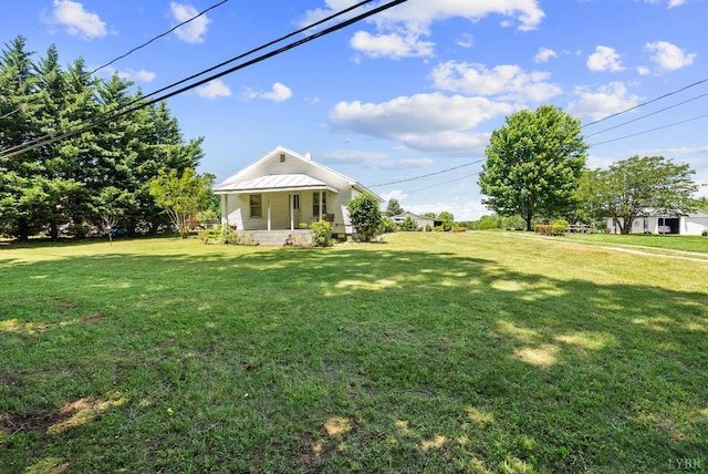 200 Jasper Wood Rd, Hurt, VA 24563 - view of green lawn with a porch