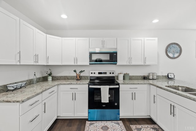 1040 Coronado Ln, Lynchburg, VA 24502 - kitchen featuring electric range, white cabinetry, dark wood-style floors, light stone countertops, and recessed lighting