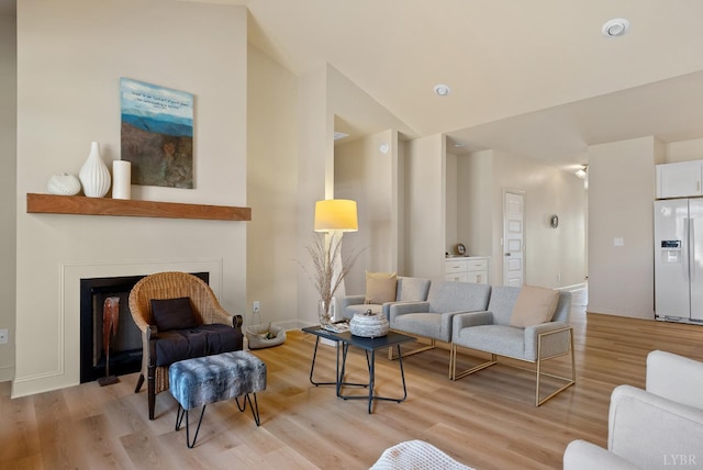 1268 Stoney Ridge Blvd, Forest, VA 24551 - living area with light wood-style flooring, a fireplace, and lofted ceiling