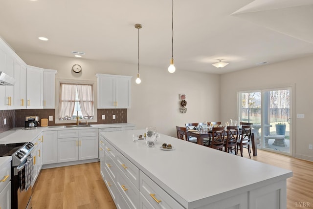 1268 Stoney Ridge Blvd, Forest, VA 24551 - kitchen with range with electric cooktop, healthy amount of natural light, light wood finished floors, backsplash, and recessed lighting
