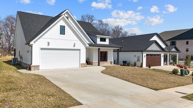 1268 Stoney Ridge Blvd, Forest, VA 24551 - modern farmhouse style home featuring driveway, a front yard, a shingled roof, board and batten siding, and cooling unit