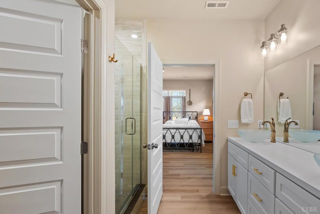 1268 Stoney Ridge Blvd, Forest, VA 24551 - ensuite bathroom featuring double vanity, wood finished floors, and a stall shower