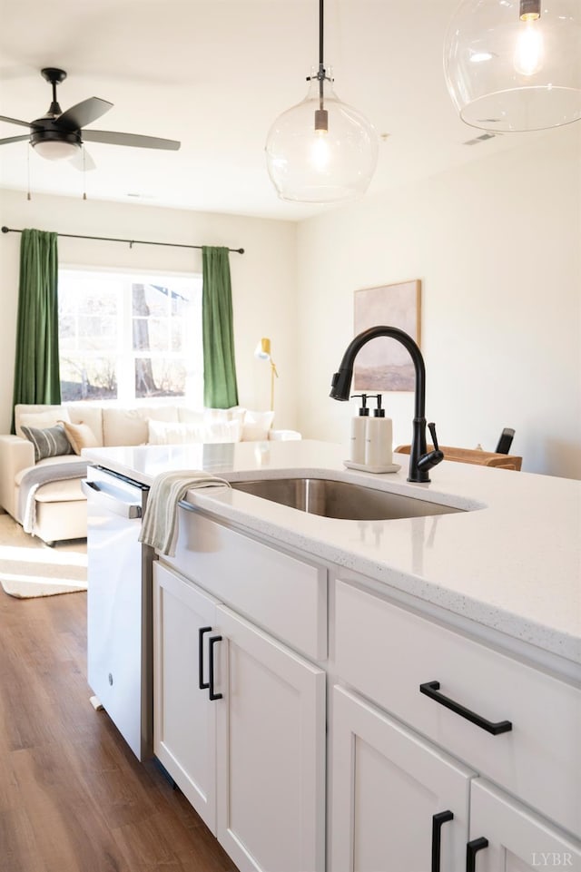 128 Brenleigh Ct Unit 105, Lynchburg, VA 24501 - kitchen featuring dishwasher, dark wood finished floors, white cabinetry, a sink, and pendant lighting
