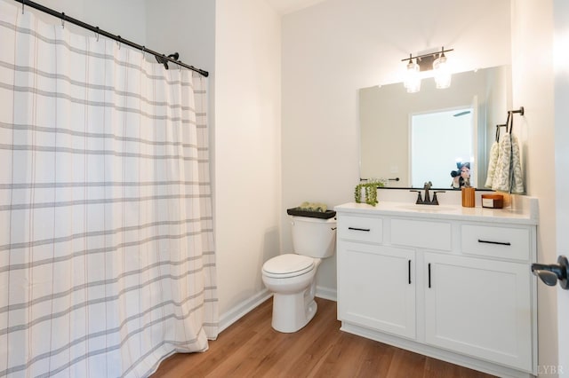 128 Brenleigh Ct Unit 105, Lynchburg, VA 24501 - full bath with toilet, wood finished floors, vanity, baseboards, and curtained shower