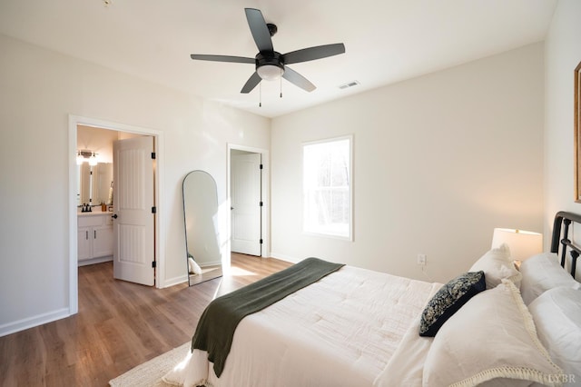 128 Brenleigh Ct Unit 105, Lynchburg, VA 24501 - bedroom with light wood finished floors, baseboards, a ceiling fan, and ensuite bath