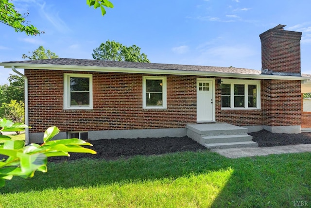 1801 Waterlick Rd, Lynchburg, VA 24501 - ranch-style home featuring a chimney, brick siding, and a front lawn