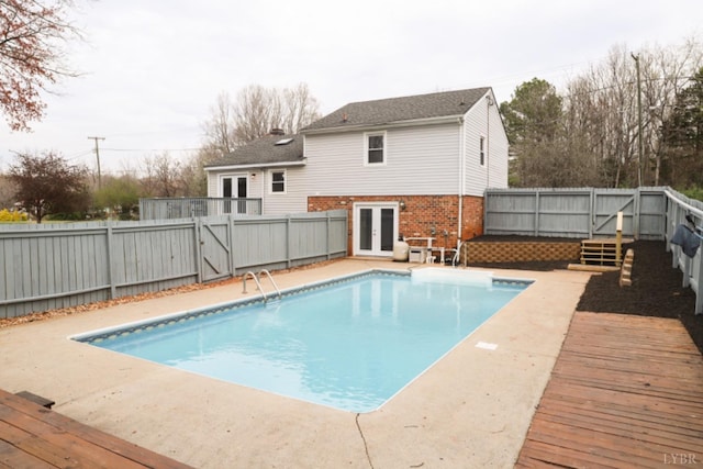 2824 Hawkins Mill Rd, Lynchburg, VA 24503 - view of swimming pool with french doors, a fenced backyard, a gate, and a wooden deck