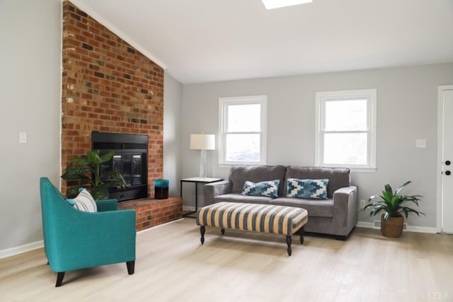 2824 Hawkins Mill Rd, Lynchburg, VA 24503 - living room featuring wood finished floors, lofted ceiling, baseboards, and a fireplace