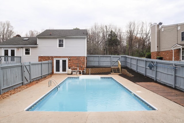 2824 Hawkins Mill Rd, Lynchburg, VA 24503 - view of swimming pool featuring french doors, a fenced backyard, a wooden deck, and a patio