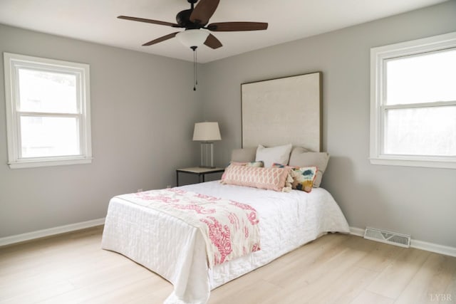 2824 Hawkins Mill Rd, Lynchburg, VA 24503 - bedroom featuring multiple windows, light wood finished floors, and baseboards