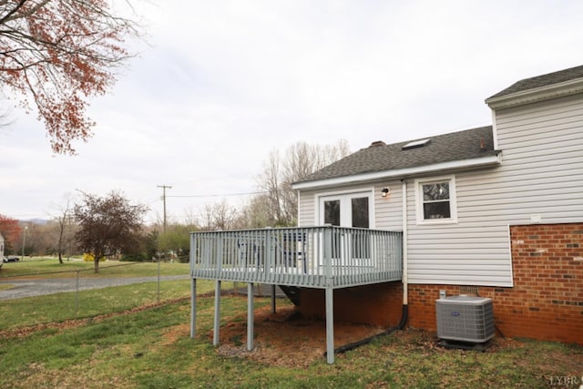 2824 Hawkins Mill Rd, Lynchburg, VA 24503 - rear view of house featuring cooling unit, a wooden deck, a lawn, brick siding, and roof with shingles