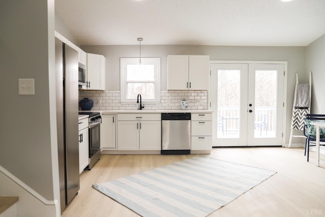 2824 Hawkins Mill Rd, Lynchburg, VA 24503 - kitchen with stainless steel appliances, white cabinetry, french doors, and light countertops