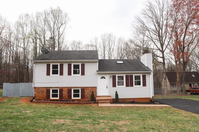 2824 Hawkins Mill Rd, Lynchburg, VA 24503 - tri-level home with a chimney, asphalt driveway, a shingled roof, and entry steps