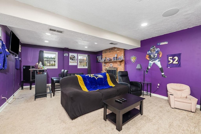 115 Mattiponi Dr, Madison Heights, VA 24572 - cinema featuring carpet flooring, baseboards, a textured ceiling, a brick fireplace, and recessed lighting