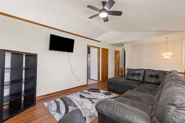115 Mattiponi Dr, Madison Heights, VA 24572 - living room featuring a chandelier, vaulted ceiling, wood finished floors, a ceiling fan, and baseboards