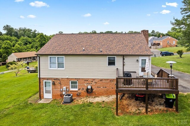 115 Mattiponi Dr, Madison Heights, VA 24572 - back of house with central AC, a wooden deck, a chimney, a yard, and brick siding