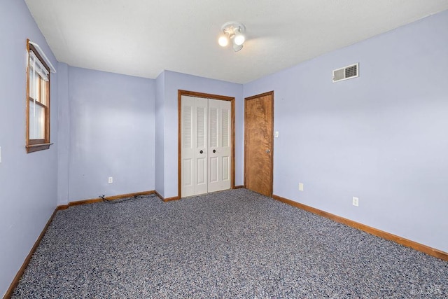 115 Mattiponi Dr, Madison Heights, VA 24572 - unfurnished bedroom with baseboards, carpet floors, and a closet