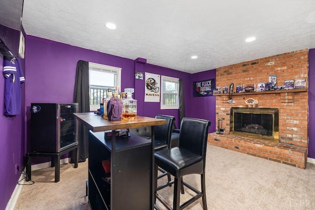 115 Mattiponi Dr, Madison Heights, VA 24572 - bar area with carpet floors, a textured ceiling, a fireplace, baseboards, and recessed lighting