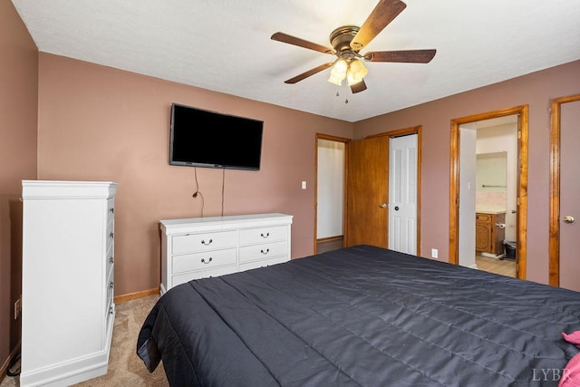 115 Mattiponi Dr, Madison Heights, VA 24572 - bedroom with light colored carpet, baseboards, ceiling fan, and ensuite bathroom