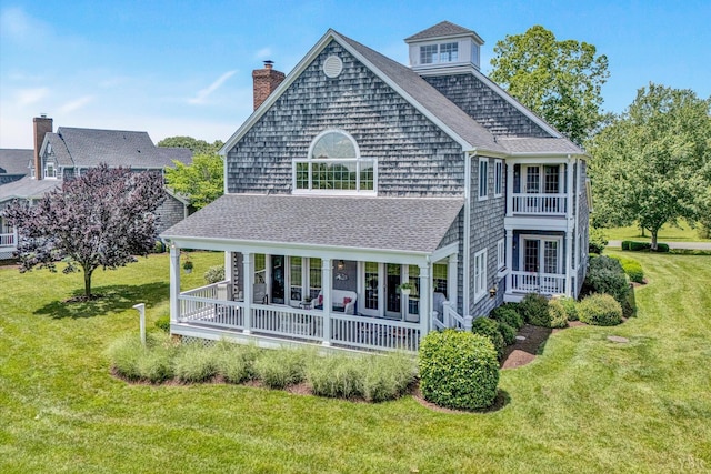 145 Golfers Crossing Dr, Penhook, VA 24137 - back of house with a yard, a porch, a shingled roof, a chimney, and a balcony