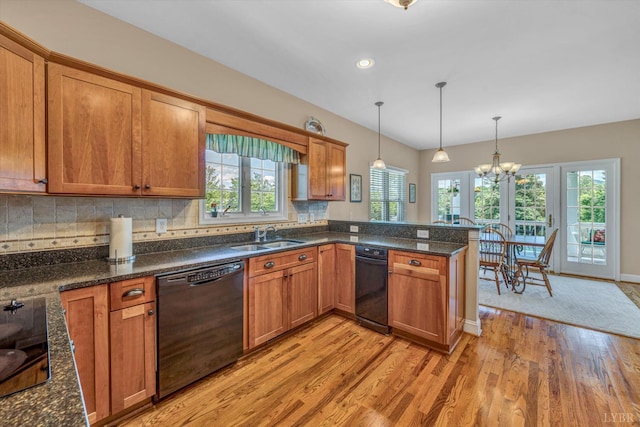 145 Golfers Crossing Dr, Penhook, VA 24137 - kitchen with black appliances, light wood finished floors, brown cabinets, healthy amount of natural light, and recessed lighting