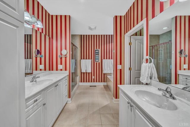 145 Golfers Crossing Dr, Penhook, VA 24137 - bathroom with wallpapered walls, two vanities, a shower stall, a bath, and tile patterned flooring