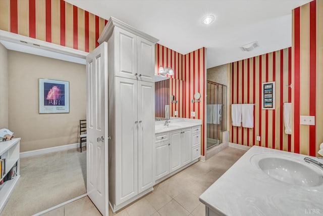 145 Golfers Crossing Dr, Penhook, VA 24137 - bathroom with wallpapered walls, vanity, a stall shower, baseboards, and tile patterned floors