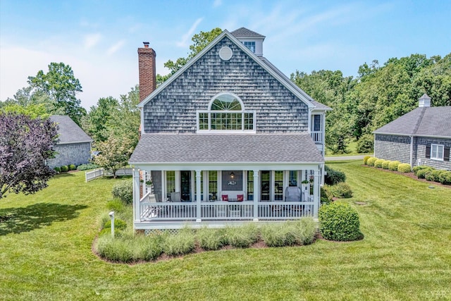 145 Golfers Crossing Dr, Penhook, VA 24137 - rear view of house featuring covered porch, a lawn, roof with shingles, and a chimney