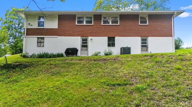 147 Maple Dr, Madison Heights, VA 24572 - back of property with central air condition unit, brick siding, a yard, and stucco siding