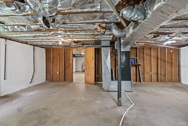 147 Maple Dr, Madison Heights, VA 24572 - unfinished below grade area featuring heating unit and concrete block wall