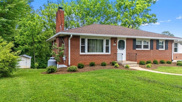 147 Maple Dr, Madison Heights, VA 24572 - bungalow-style home featuring a chimney, a front yard, brick siding, and roof with shingles
