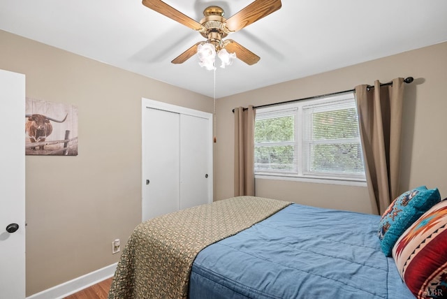 147 Maple Dr, Madison Heights, VA 24572 - bedroom with wood finished floors, baseboards, a closet, and a ceiling fan