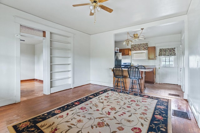 10662 Lee Jackson Hwy, Big Island, VA 24526 - kitchen with built in shelves, wood finished floors, baseboards, and a ceiling fan