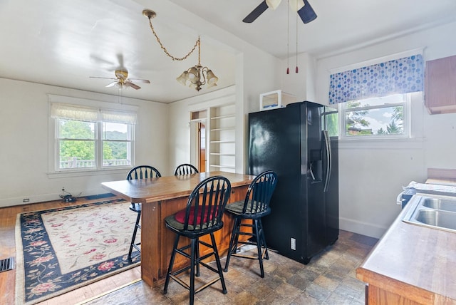 10662 Lee Jackson Hwy, Big Island, VA 24526 - kitchen featuring black fridge, ceiling fan, and plenty of natural light