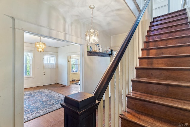 10662 Lee Jackson Hwy, Big Island, VA 24526 - stairs with a chandelier, wood finished floors, and baseboards