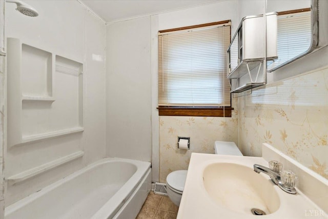 1104 Amherst Ave, Altavista, VA 24517 - bathroom with a sink, toilet, wallpapered walls, tile patterned flooring, and shower / bathtub combination