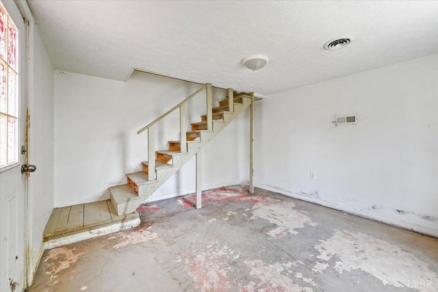 1104 Amherst Ave, Altavista, VA 24517 - below grade area with stairs and a textured ceiling