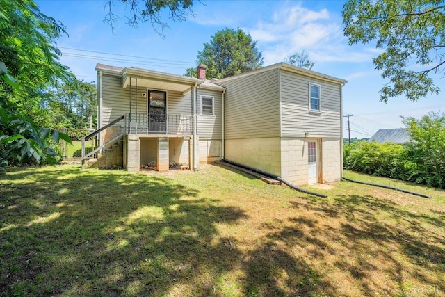 1104 Amherst Ave, Altavista, VA 24517 - back of house featuring a lawn