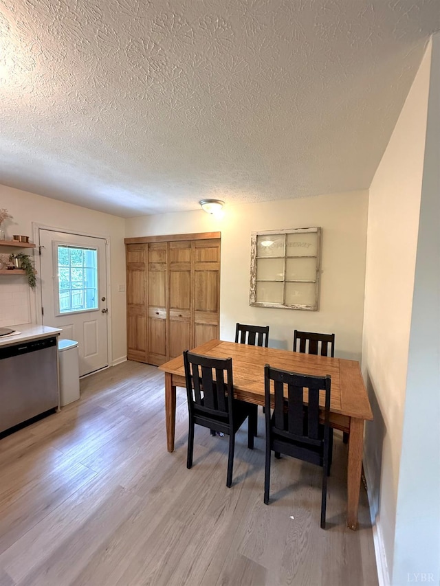 136 Jubilee Dr, Lynchburg, VA 24501 - dining area with a textured ceiling, light wood-type flooring, and baseboards