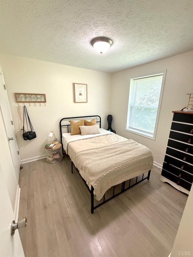 136 Jubilee Dr, Lynchburg, VA 24501 - bedroom with wood finished floors, baseboards, and a textured ceiling