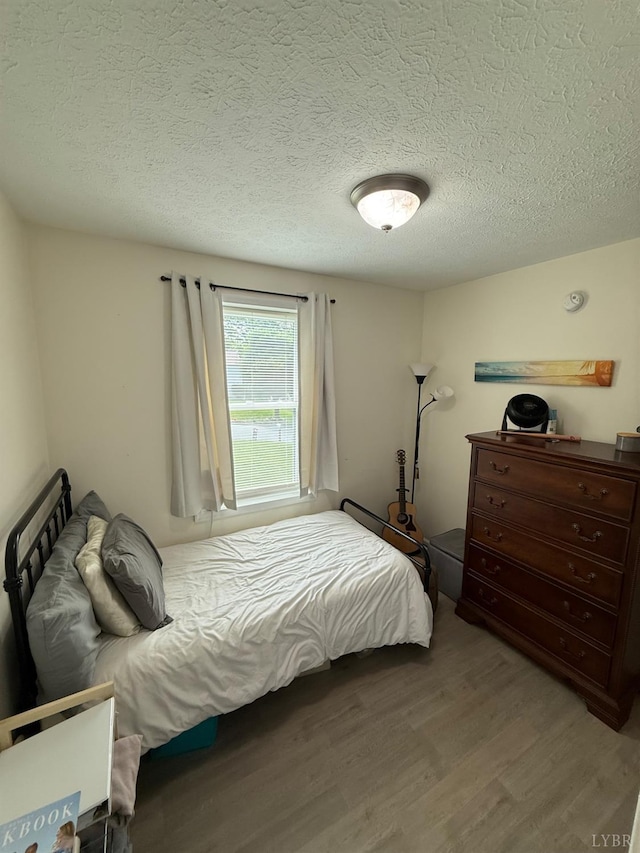 136 Jubilee Dr, Lynchburg, VA 24501 - bedroom with wood finished floors and a textured ceiling