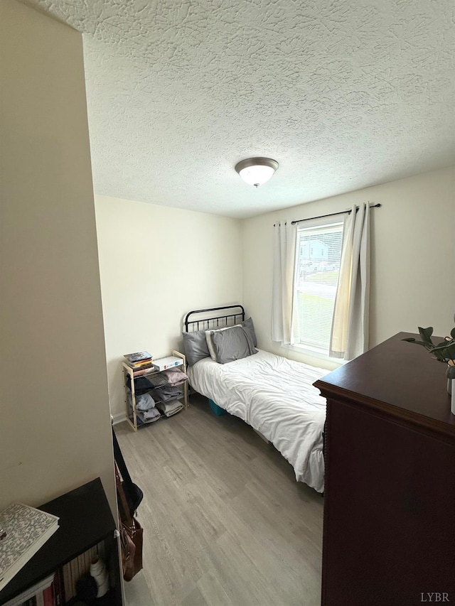 136 Jubilee Dr, Lynchburg, VA 24501 - bedroom with wood finished floors and a textured ceiling