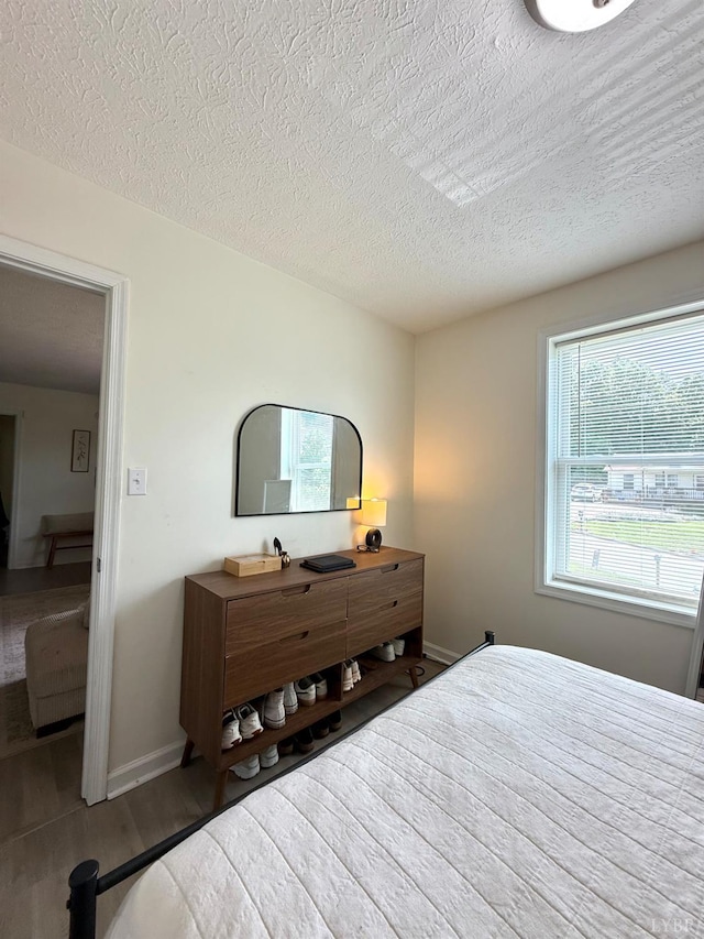 136 Jubilee Dr, Lynchburg, VA 24501 - bedroom with a textured ceiling, wood finished floors, and baseboards