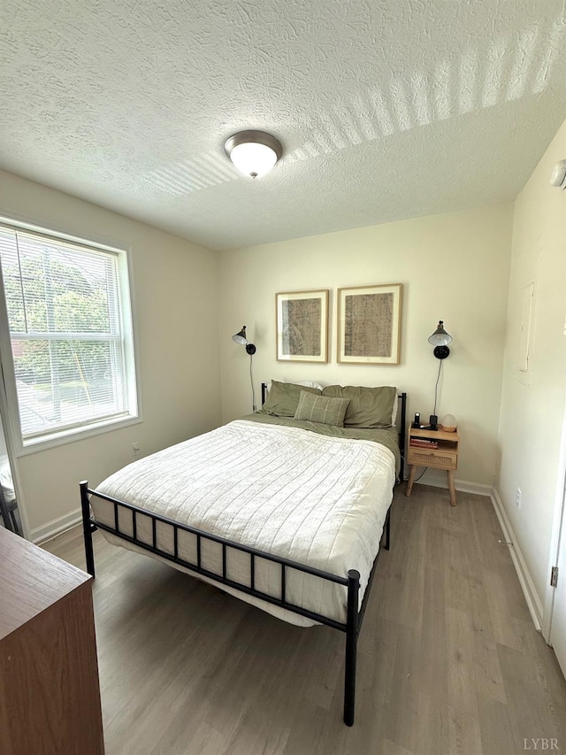 136 Jubilee Dr, Lynchburg, VA 24501 - bedroom featuring wood finished floors, baseboards, and a textured ceiling